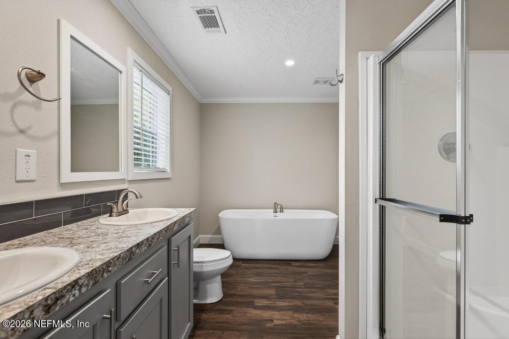 95605 Springhill Road Fernandina Beach, FL 32034 - Photo 35 of 62 a bathroom with a granite countertop sink and a mirror