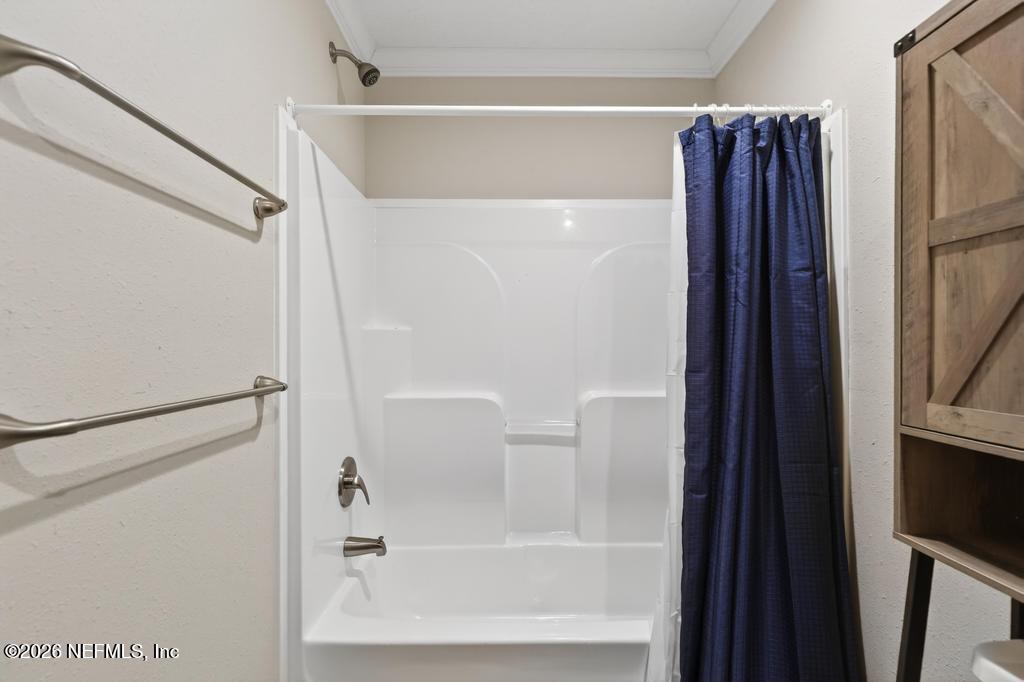 95605 Springhill Road Fernandina Beach, FL 32034 - Photo 42 of 62 a bathroom with a bathtub and a shower