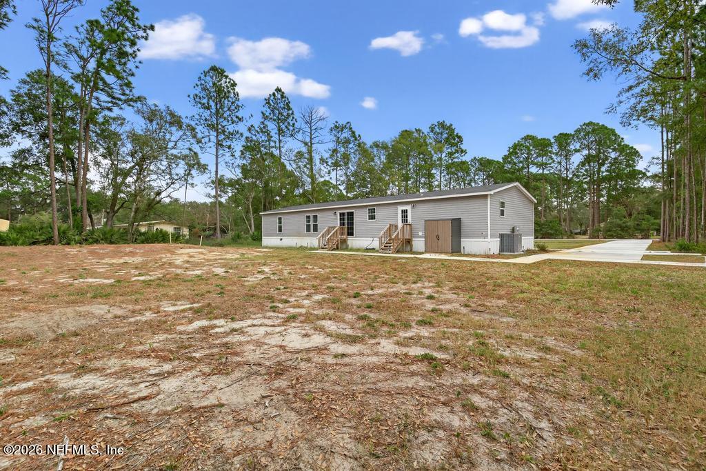 95605 Springhill Road Fernandina Beach, FL 32034 - Photo 51 of 62 a house view with a backyard space