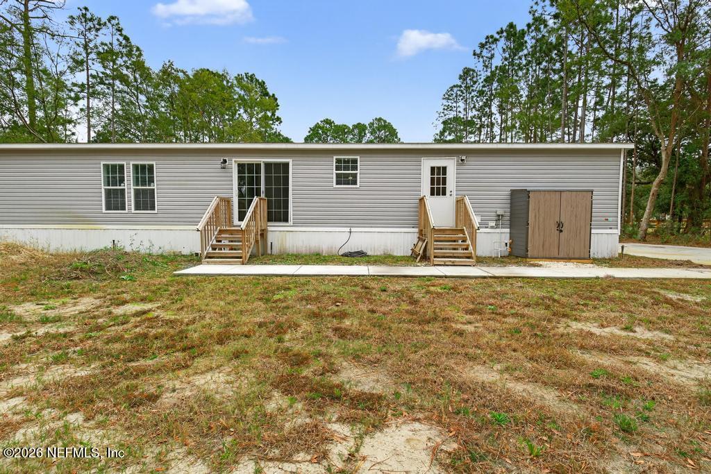 95605 Springhill Road Fernandina Beach, FL 32034 - Photo 52 of 62 front view of a house with a yard