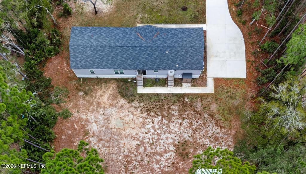 95605 Springhill Road Fernandina Beach, FL 32034 - Photo 57 of 62 an aerial view of a house with a yard