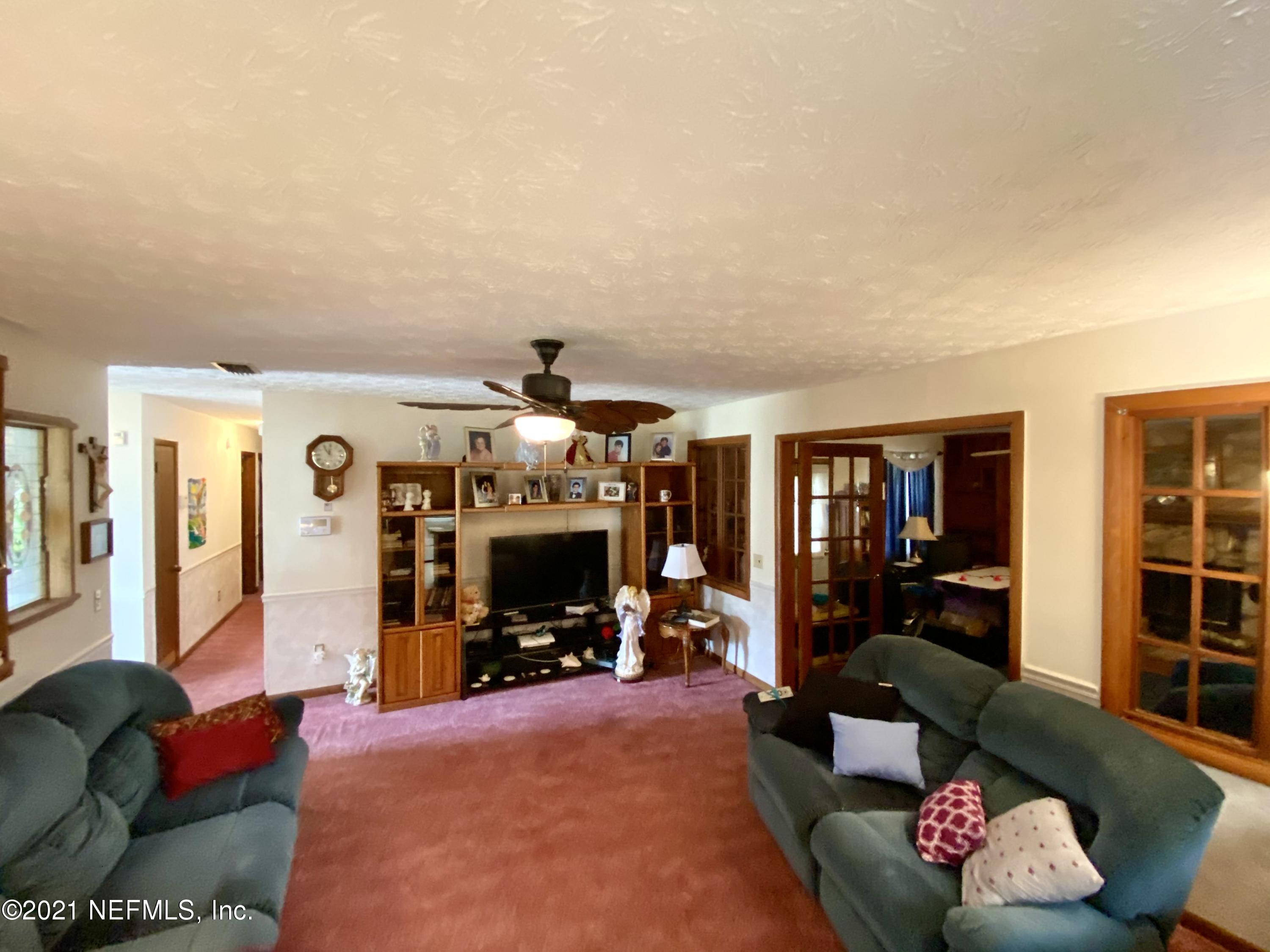 10981 Cisco Gardens Road North Jacksonville, FL 32219 - Photo 12 of 53 LIVING ROOM TO FIREPLACE AND GAME ROOM