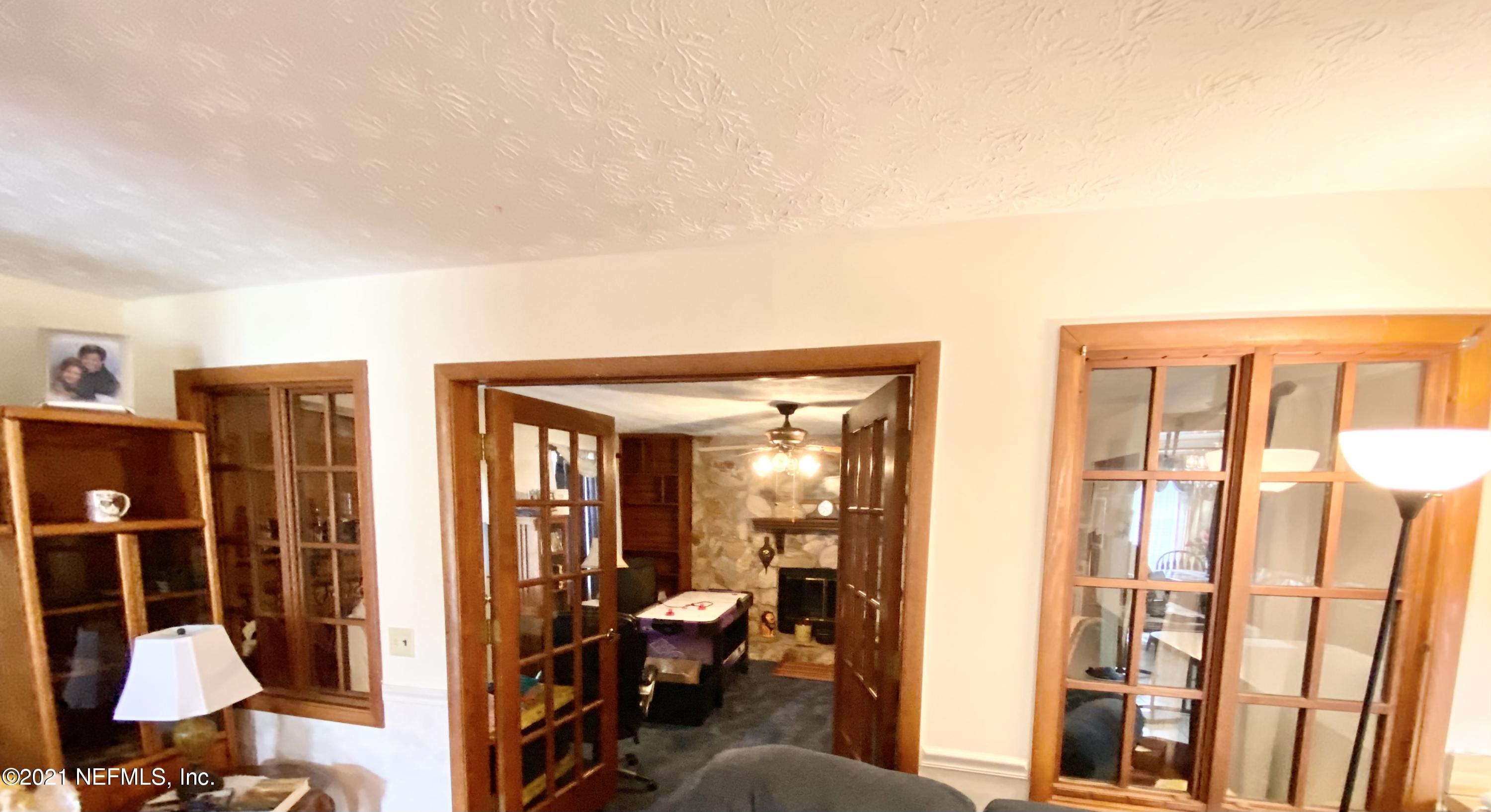 10981 Cisco Gardens Road North Jacksonville, FL 32219 - Photo 39 of 53 LIVING ROOM TO FIREPLACE AND GAME ROOM