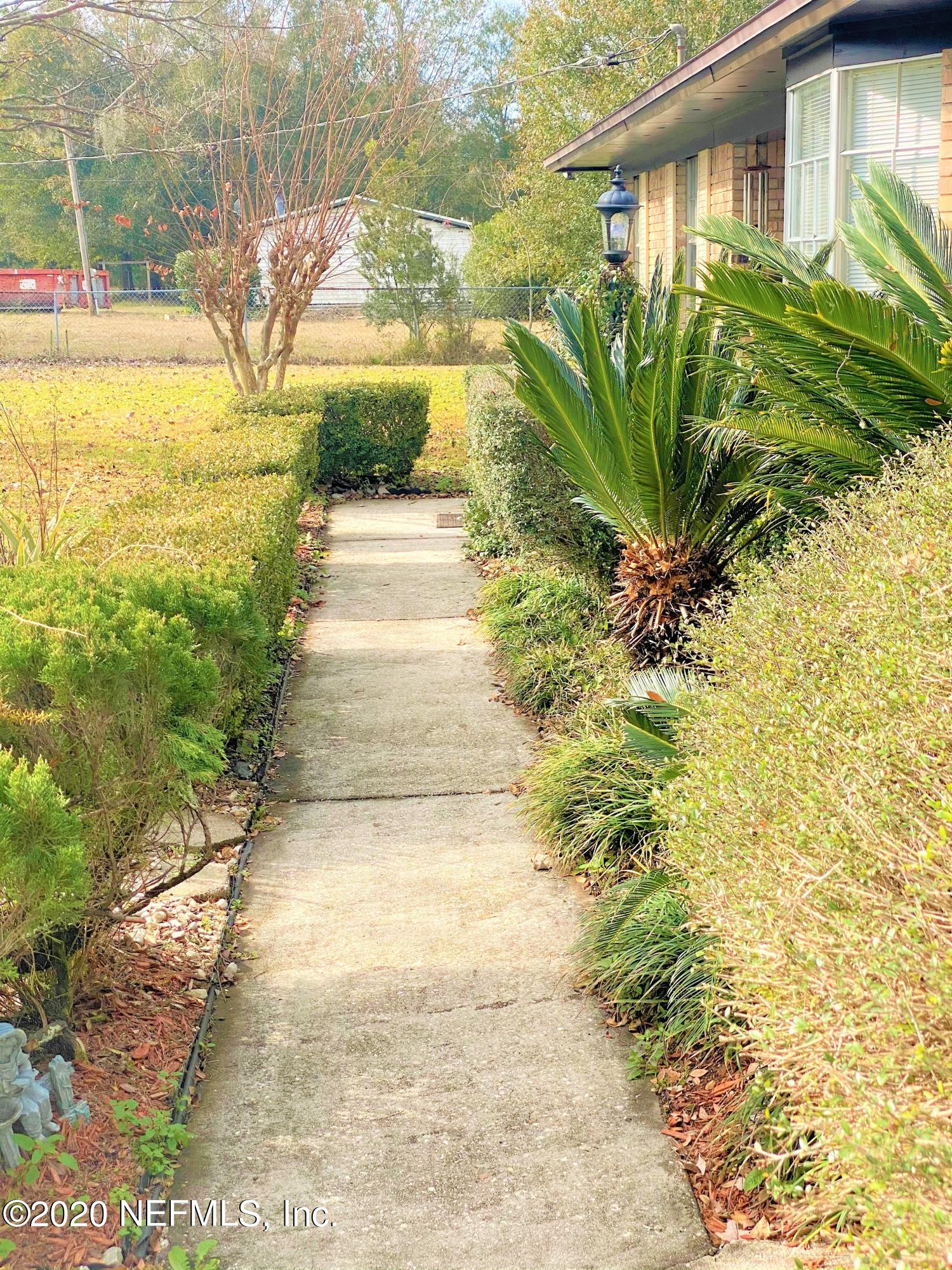 10981 Cisco Gardens Road North Jacksonville, FL 32219 - Photo 5 of 53 SIDEWALK TO FRONT DOOR