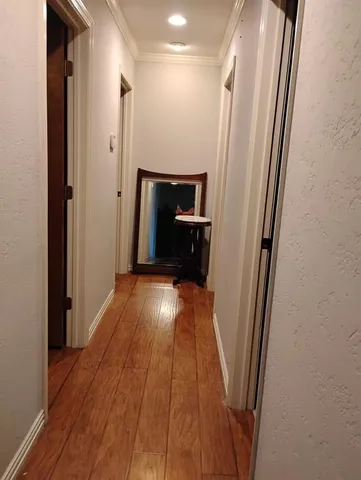 a view of entryway with wooden floor