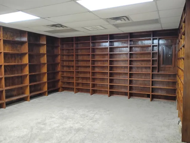 a view of an empty room with shelves
