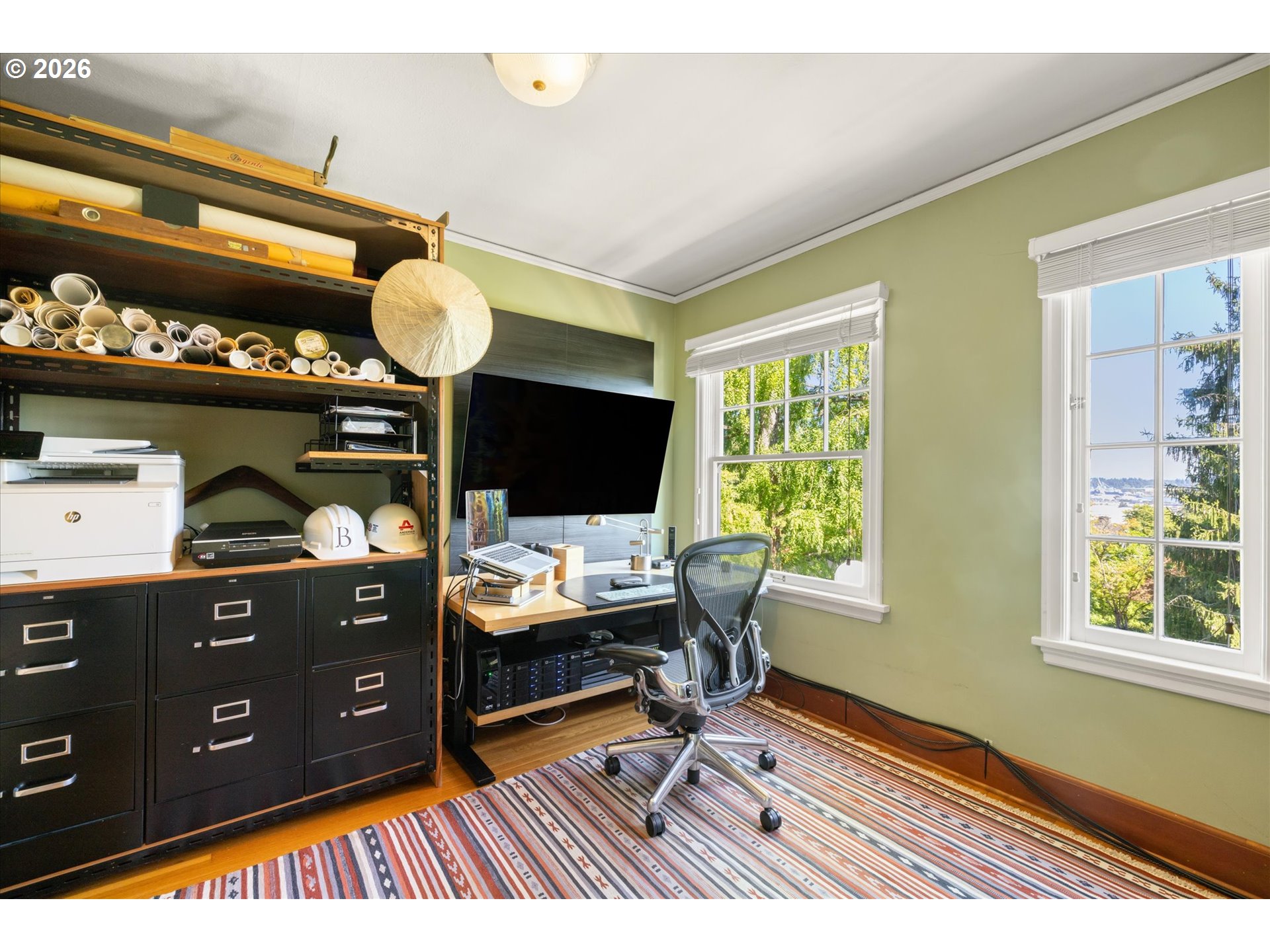 2939 Northwest Cornell Road Portland, OR 97210 - Photo 24 of 42 a view of a workspace with furniture and a window