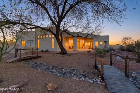 a view of a house with a yard and a mountain