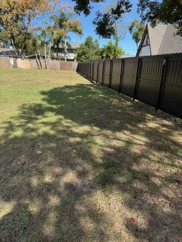 a view of swimming pool with a yard
