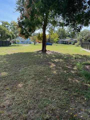 a view of outdoor space with trees all around