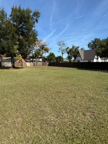 a view of a field with an trees