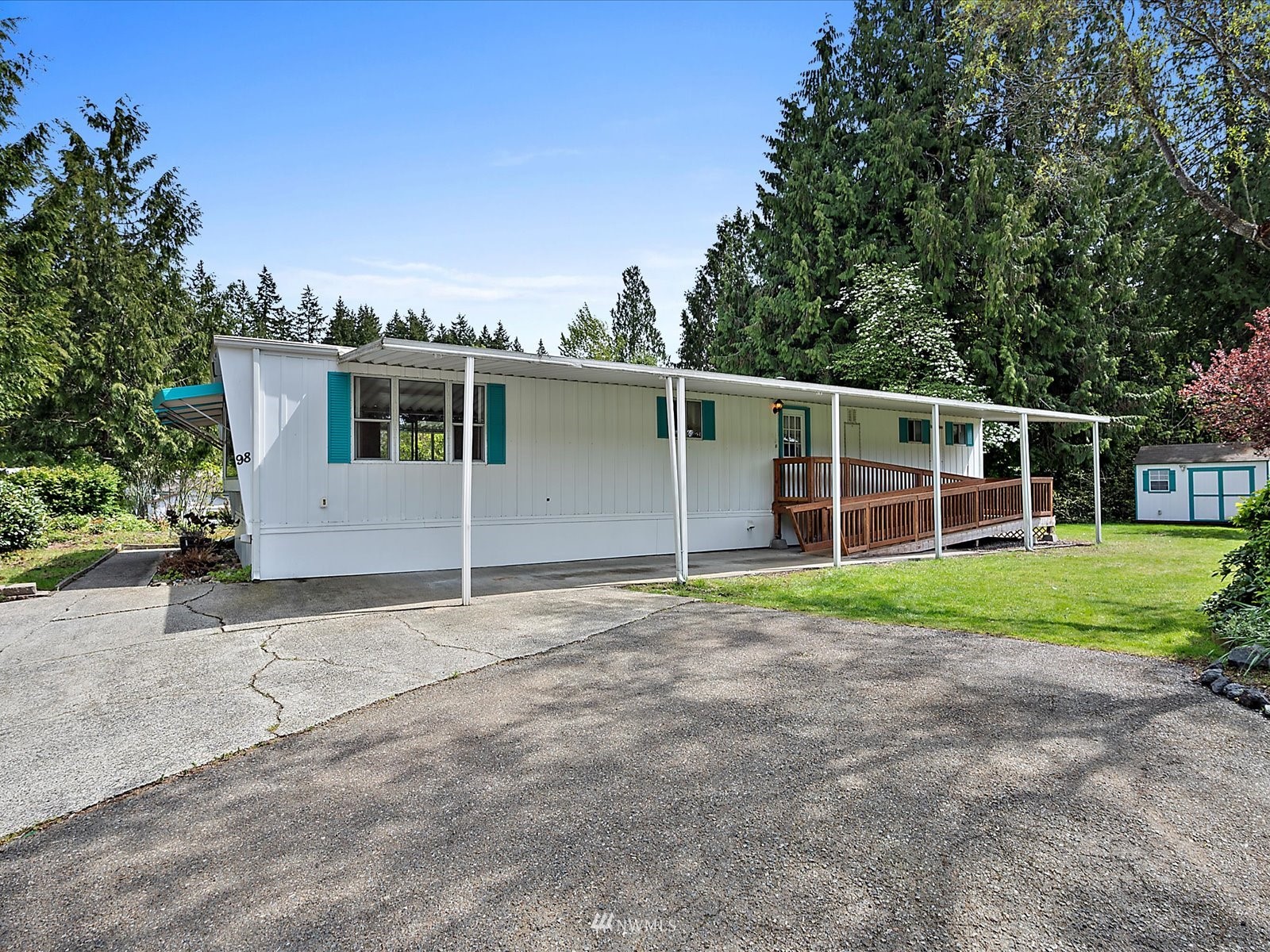 3333 228th Street Southeast, Unit 98 Bothell, WA 98021 - Photo 1 of 18 a view of house with backyard space and garden