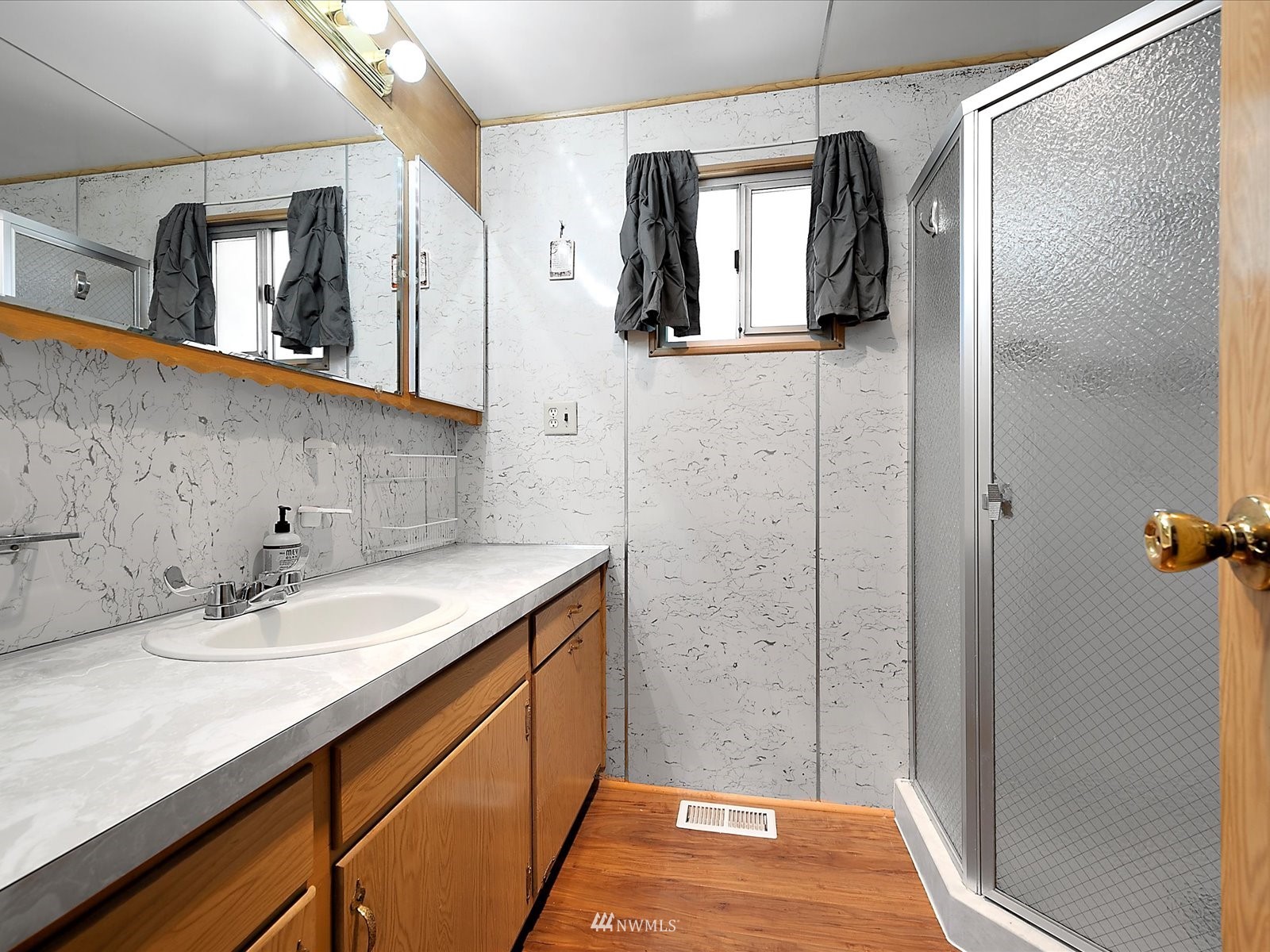 3333 228th Street Southeast, Unit 98 Bothell, WA 98021 - Photo 11 of 18 a bathroom with a sink and mirror