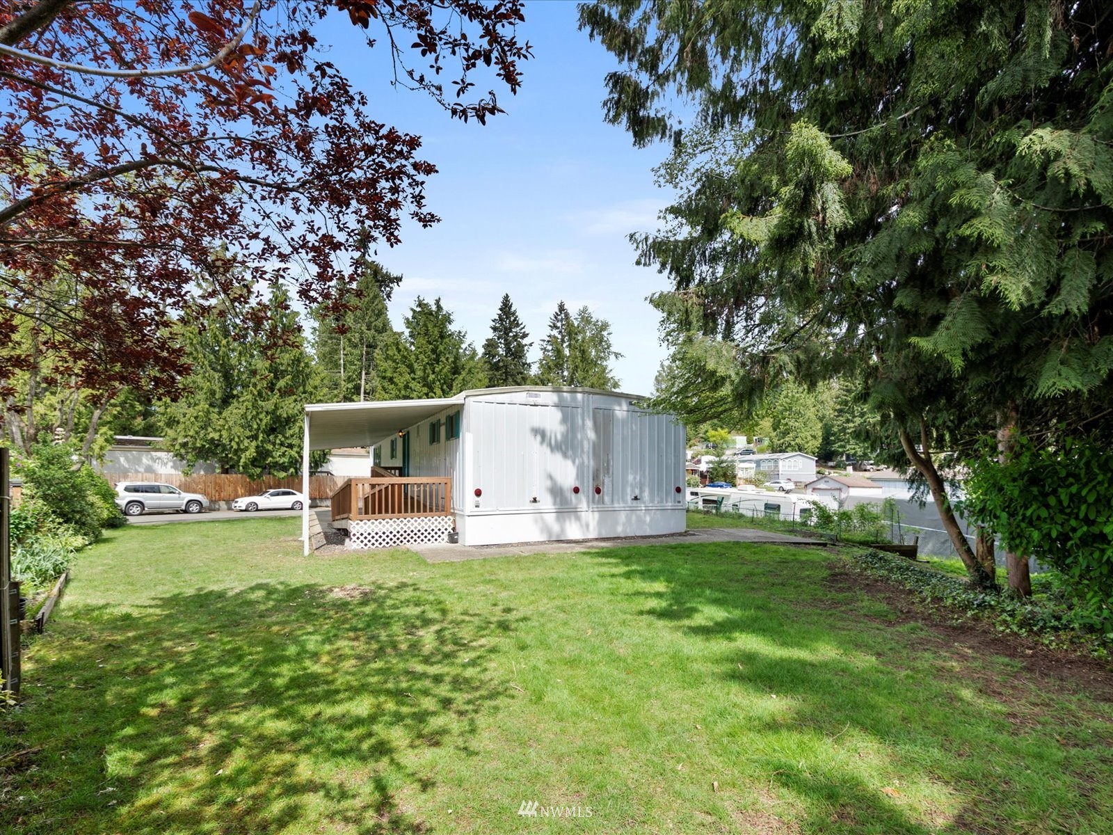 3333 228th Street Southeast, Unit 98 Bothell, WA 98021 - Photo 16 of 18 a view of a chair and table of the garden