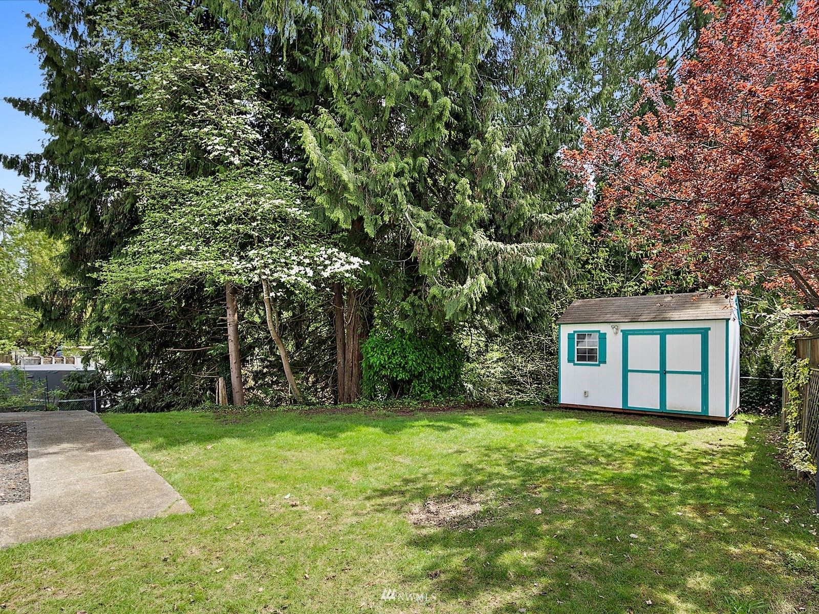 3333 228th Street Southeast, Unit 98 Bothell, WA 98021 - Photo 17 of 18 a house with tree in front of it