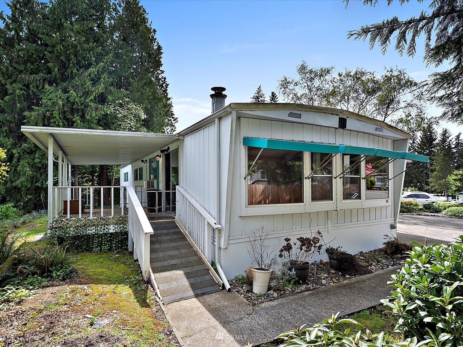 3333 228th Street Southeast, Unit 98 Bothell, WA 98021 - Photo 18 of 18 a front view of a house with a garden