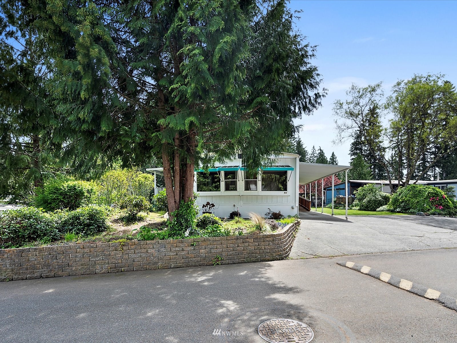 3333 228th Street Southeast, Unit 98 Bothell, WA 98021 - Photo 2 of 18 front view of a house with a yard
