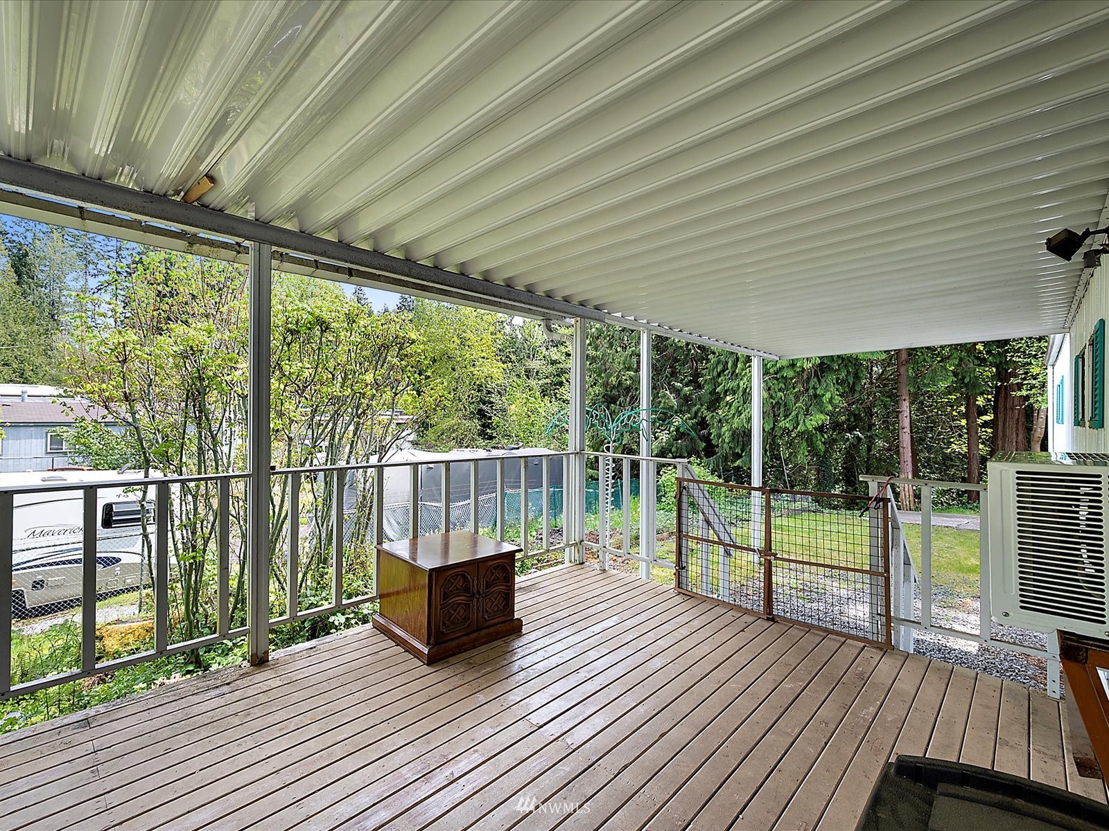 3333 228th Street Southeast, Unit 98 Bothell, WA 98021 - Photo 3 of 18 a view of balcony with wooden floor and fence