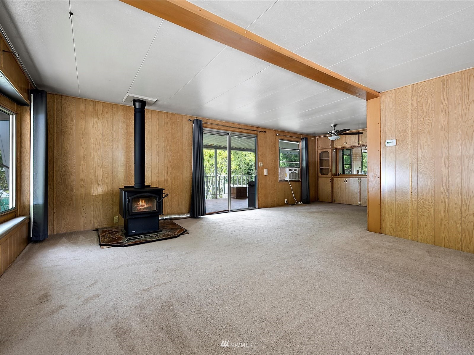 3333 228th Street Southeast, Unit 98 Bothell, WA 98021 - Photo 6 of 18 a view of an empty room with a fireplace