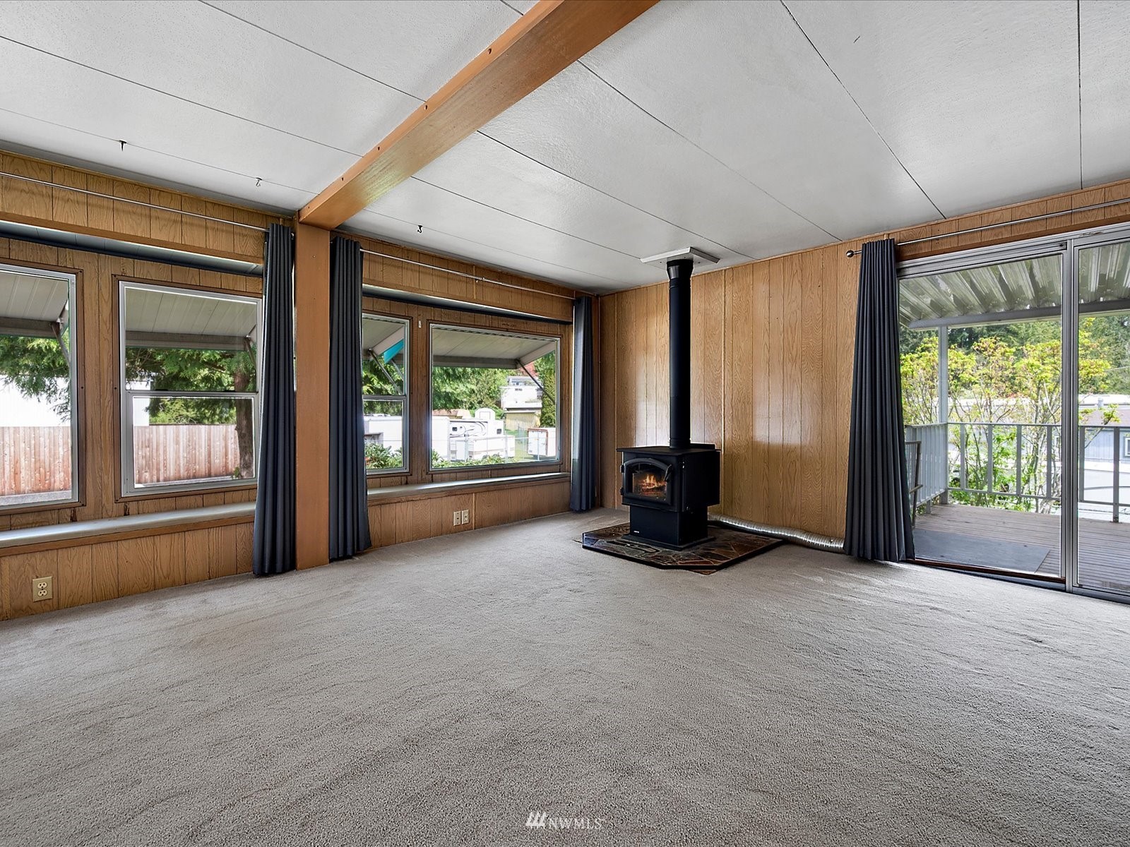 3333 228th Street Southeast, Unit 98 Bothell, WA 98021 - Photo 7 of 18 a view of a room with furniture and large windows