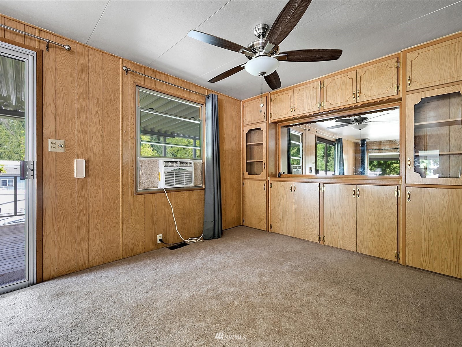 3333 228th Street Southeast, Unit 98 Bothell, WA 98021 - Photo 8 of 18 a view of a big room with windows chandelier