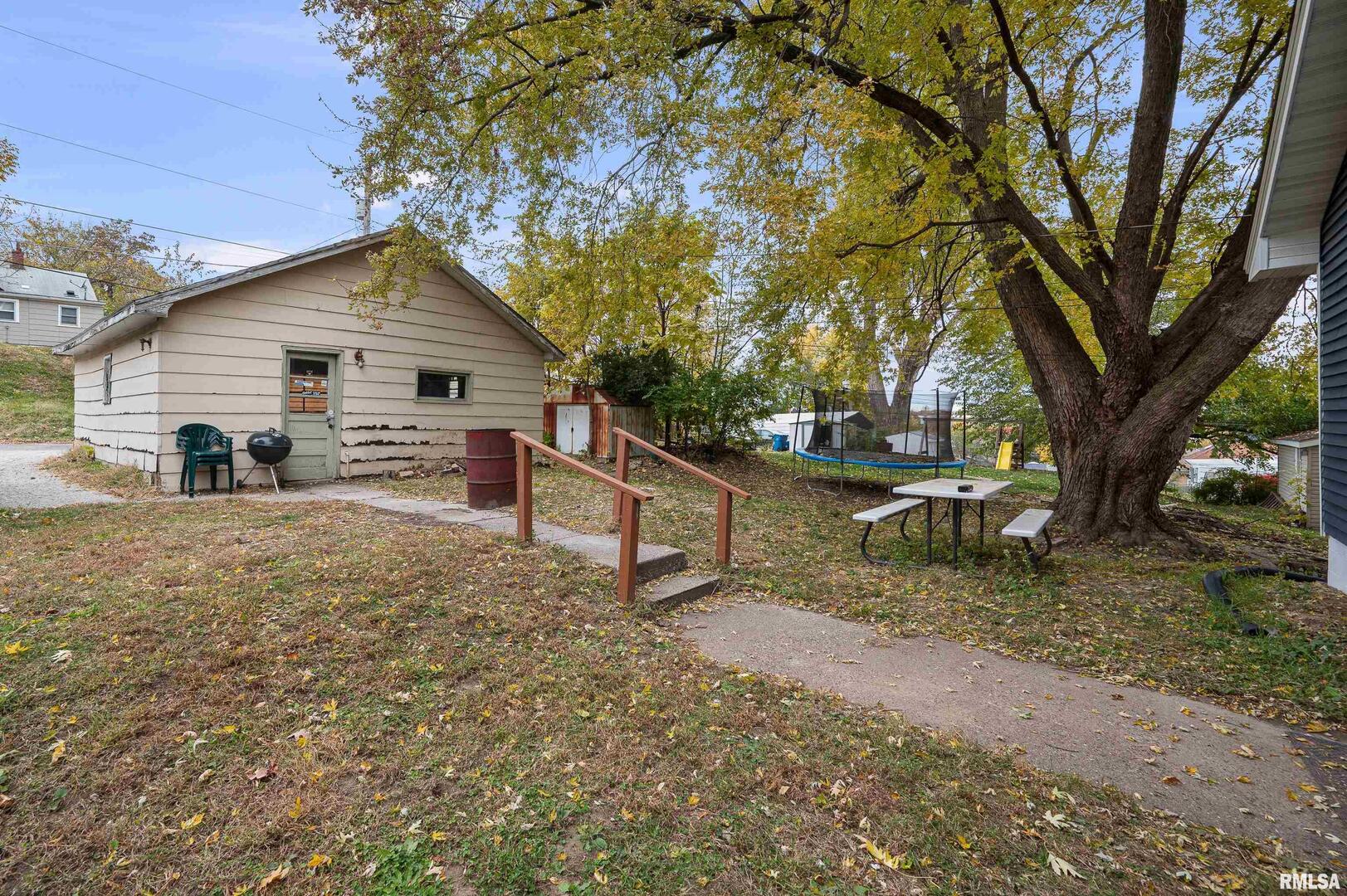 158 5th Street Silvis, IL 61282 - Photo 20 of 23 a view of house with trees in the background