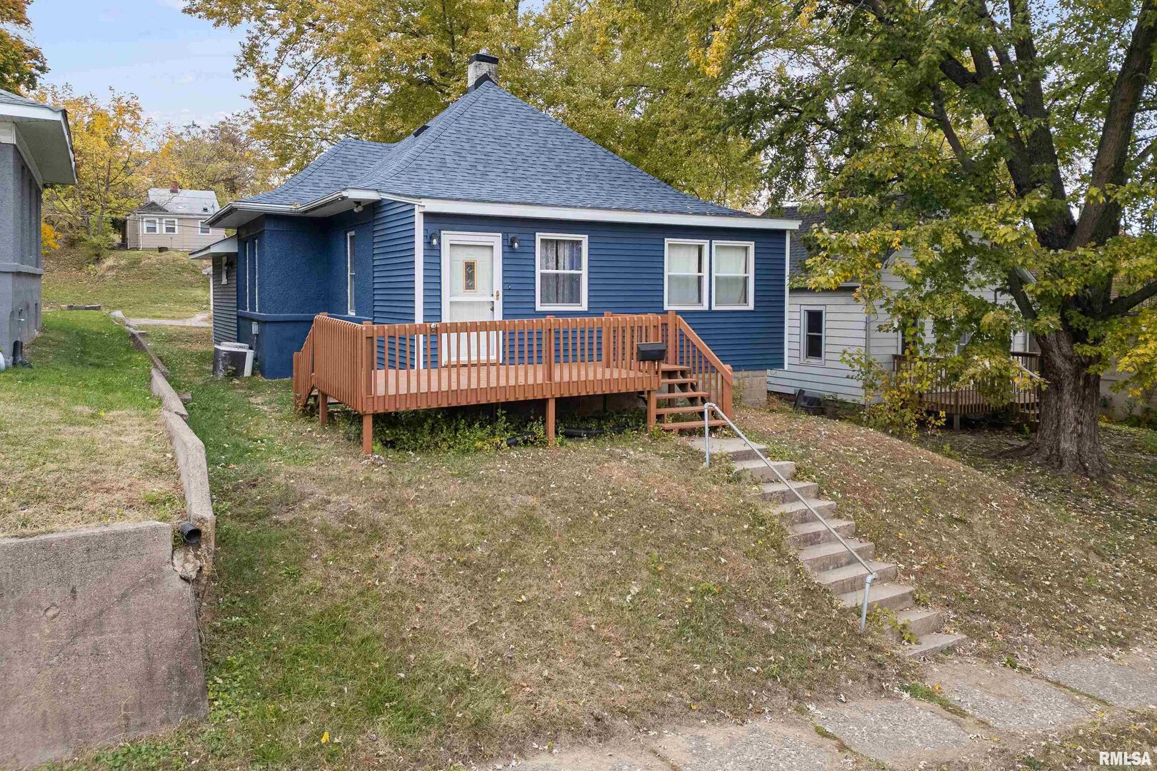 158 5th Street Silvis, IL 61282 - Photo 2 of 23 a view of a house with a yard and wooden fence