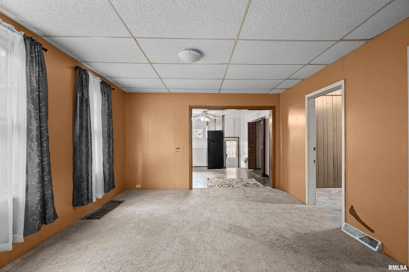158 5th Street Silvis, IL 61282 - Photo 6 of 23 a view of a hallway with wooden shelves