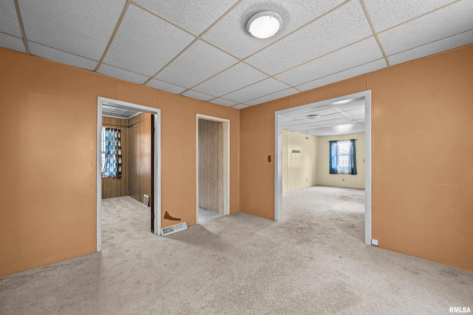 158 5th Street Silvis, IL 61282 - Photo 7 of 23 a view of a hallway with wooden shelves