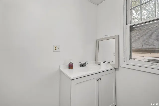 a bathroom with a shower and a toilet