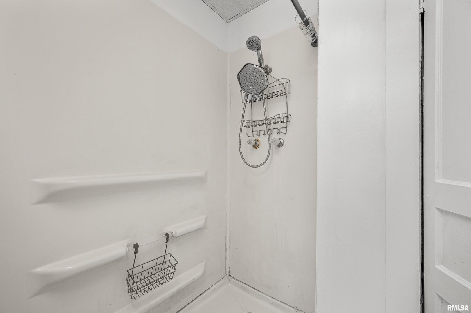 158 5th Street Silvis, IL 61282 - Photo 10 of 23 a bathroom with a shower and a toilet