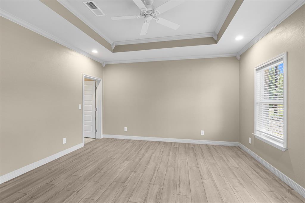 1011 Southeast County Road Corsicana, TX 75109 - Photo 18 of 40 wooden floor in an empty room with a window