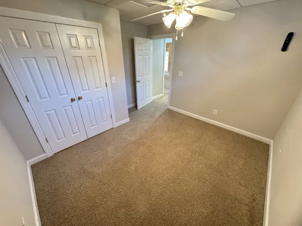 a view of a porch with wooden floor