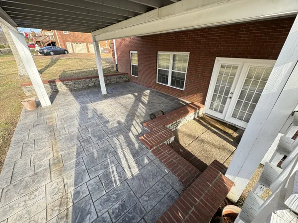 a view of a yard with snow on the road