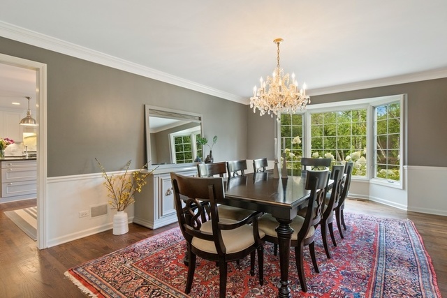 575 Turicum Road Lake Forest, IL 60045 - Photo 4 of 22 a dining room with furniture a chandelier and wooden floor
