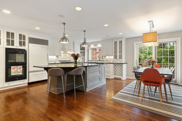 575 Turicum Road Lake Forest, IL 60045 - Photo 5 of 22 a dining hall with stainless steel appliances granite countertop a dining table chairs and a fireplace