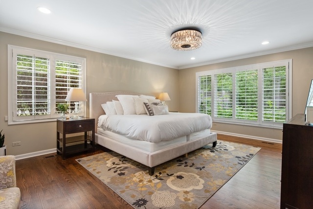 575 Turicum Road Lake Forest, IL 60045 - Photo 8 of 22 a bedroom with a large bed and a large window