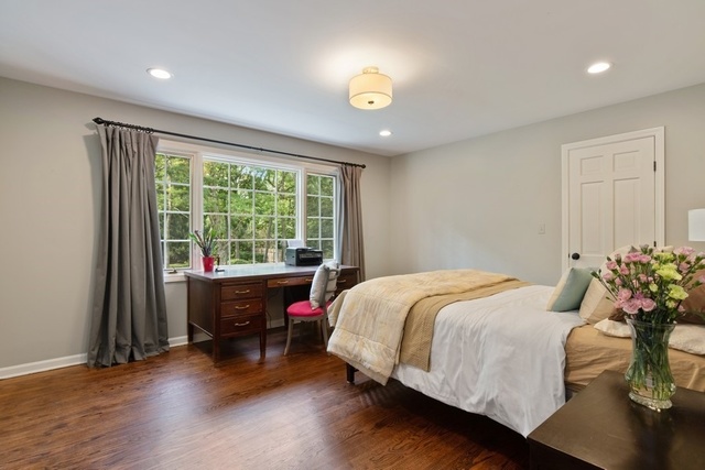 575 Turicum Road Lake Forest, IL 60045 - Photo 10 of 22 a bedroom with a bed and a large window