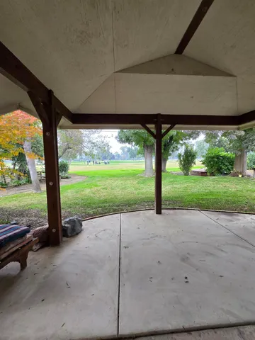a garden view with a swimming pool