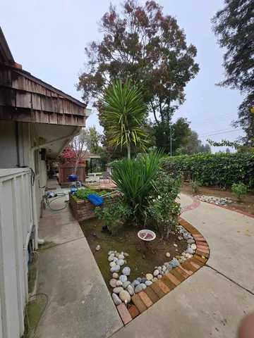 a view of a backyard with sitting area