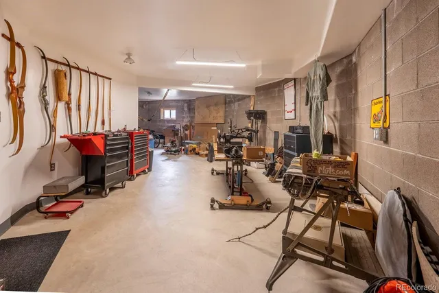 a room with gym equipment and view of living room