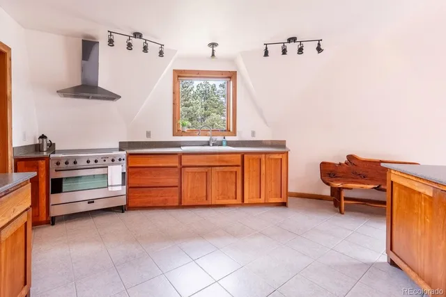 a kitchen with a sink and a stove