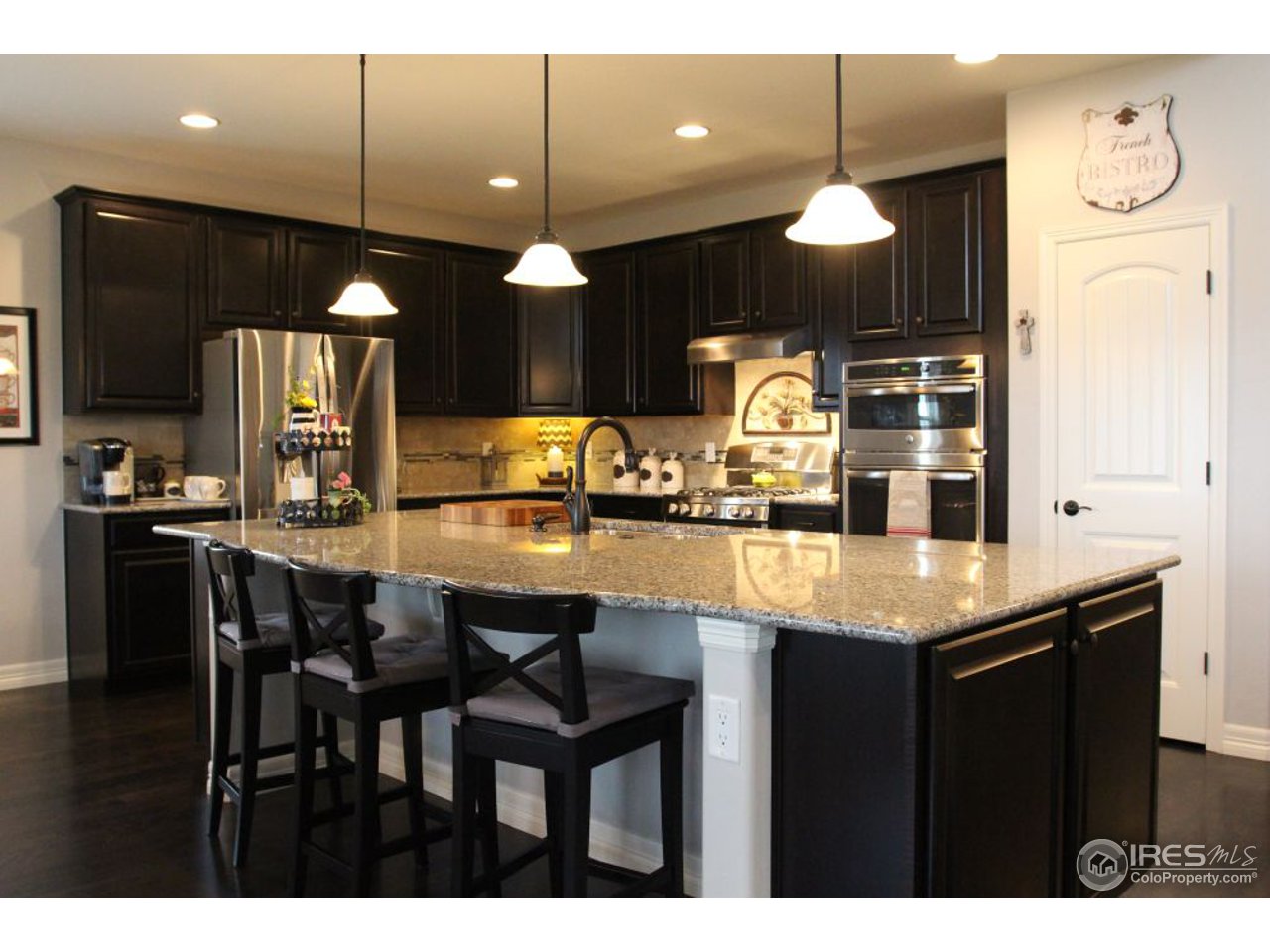 3319 Tranquility Way Berthoud, CO 80513 - Photo 13 of 40 a kitchen with a counter space cabinets and appliances