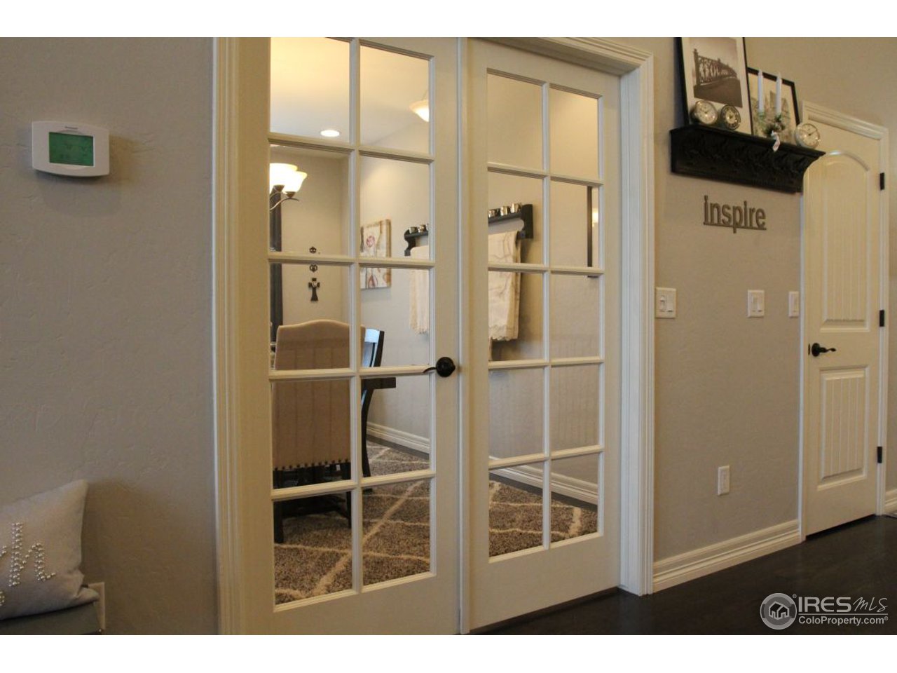 3319 Tranquility Way Berthoud, CO 80513 - Photo 20 of 40 a balcony with table and chairs