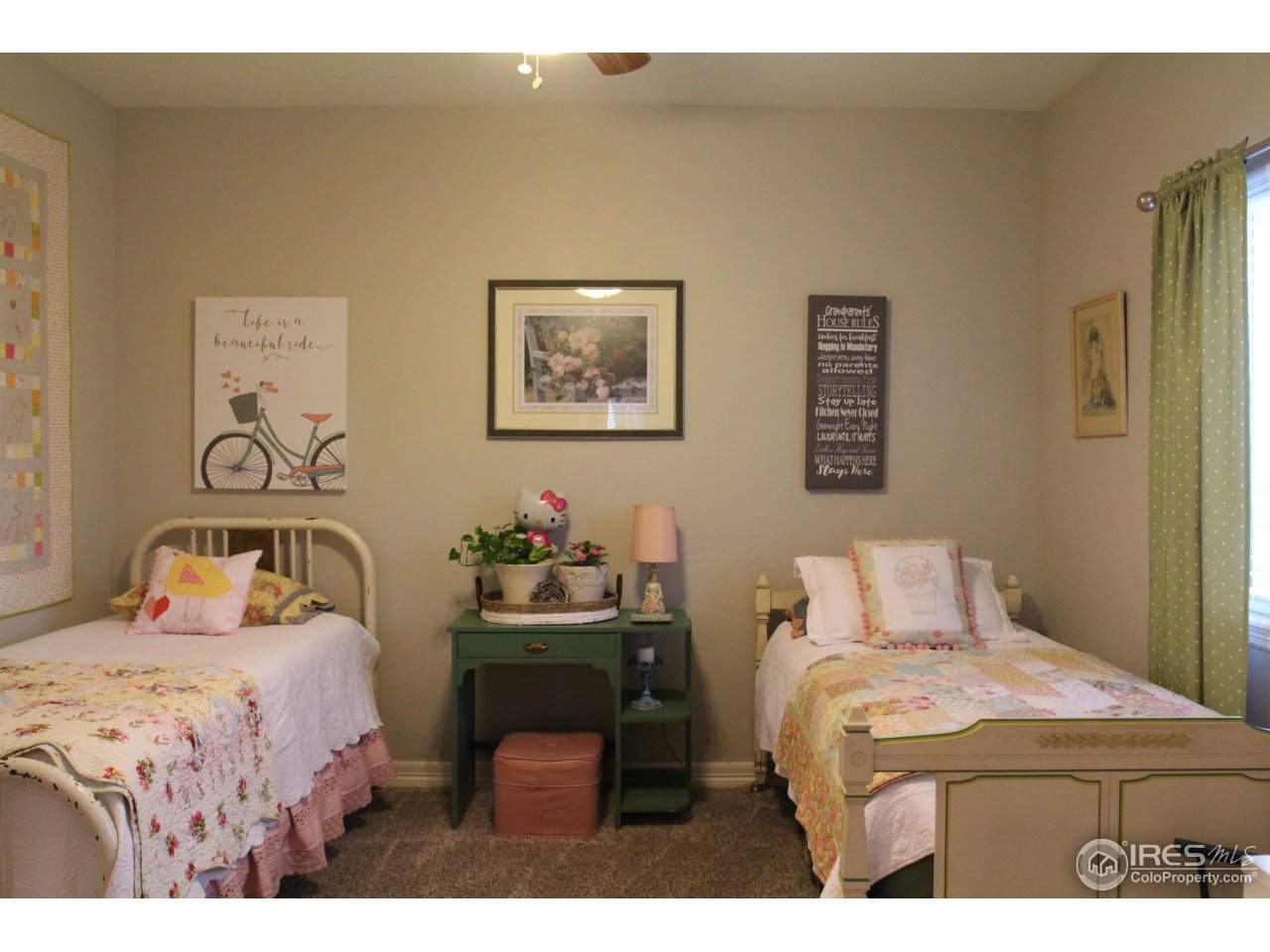 3319 Tranquility Way Berthoud, CO 80513 - Photo 28 of 40 a bedroom with a bed and wooden floor