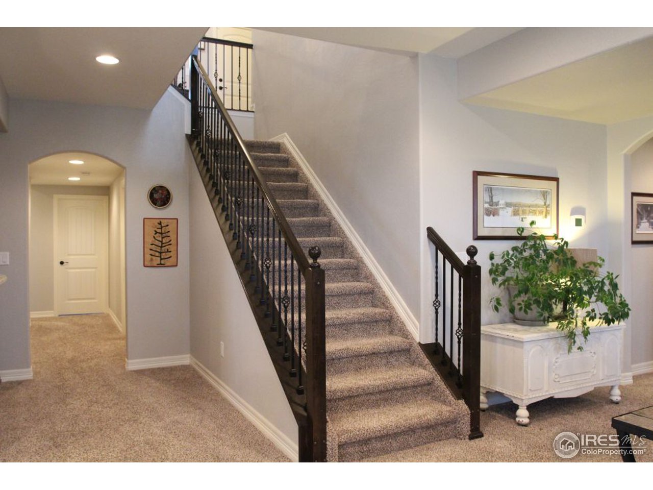 3319 Tranquility Way Berthoud, CO 80513 - Photo 30 of 40 a view of entryway and hall with wooden floor