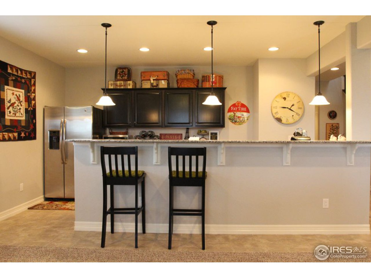 3319 Tranquility Way Berthoud, CO 80513 - Photo 36 of 40 a open kitchen with a table and chairs in it
