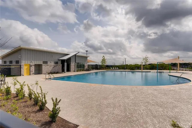 a view of a house with swimming pool