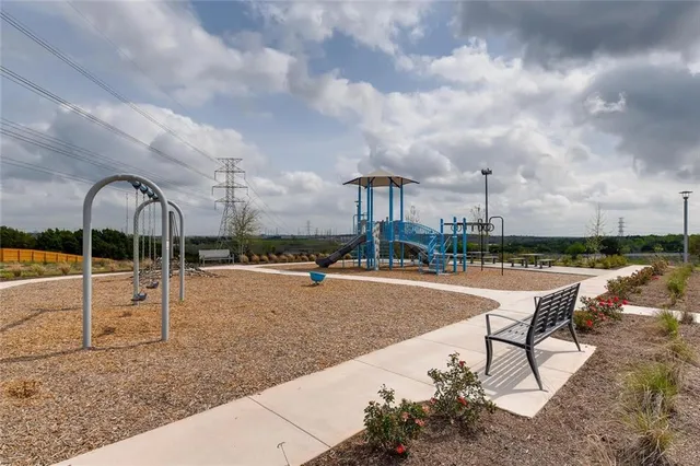 a view of a swimming pool with a lounge chair