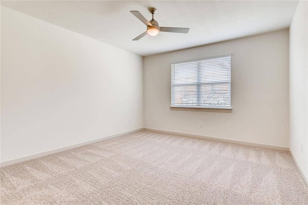 8033 Linnie Lane Austin, TX 78724 - Photo 6 of 17 an empty room with a window and a ceiling fan